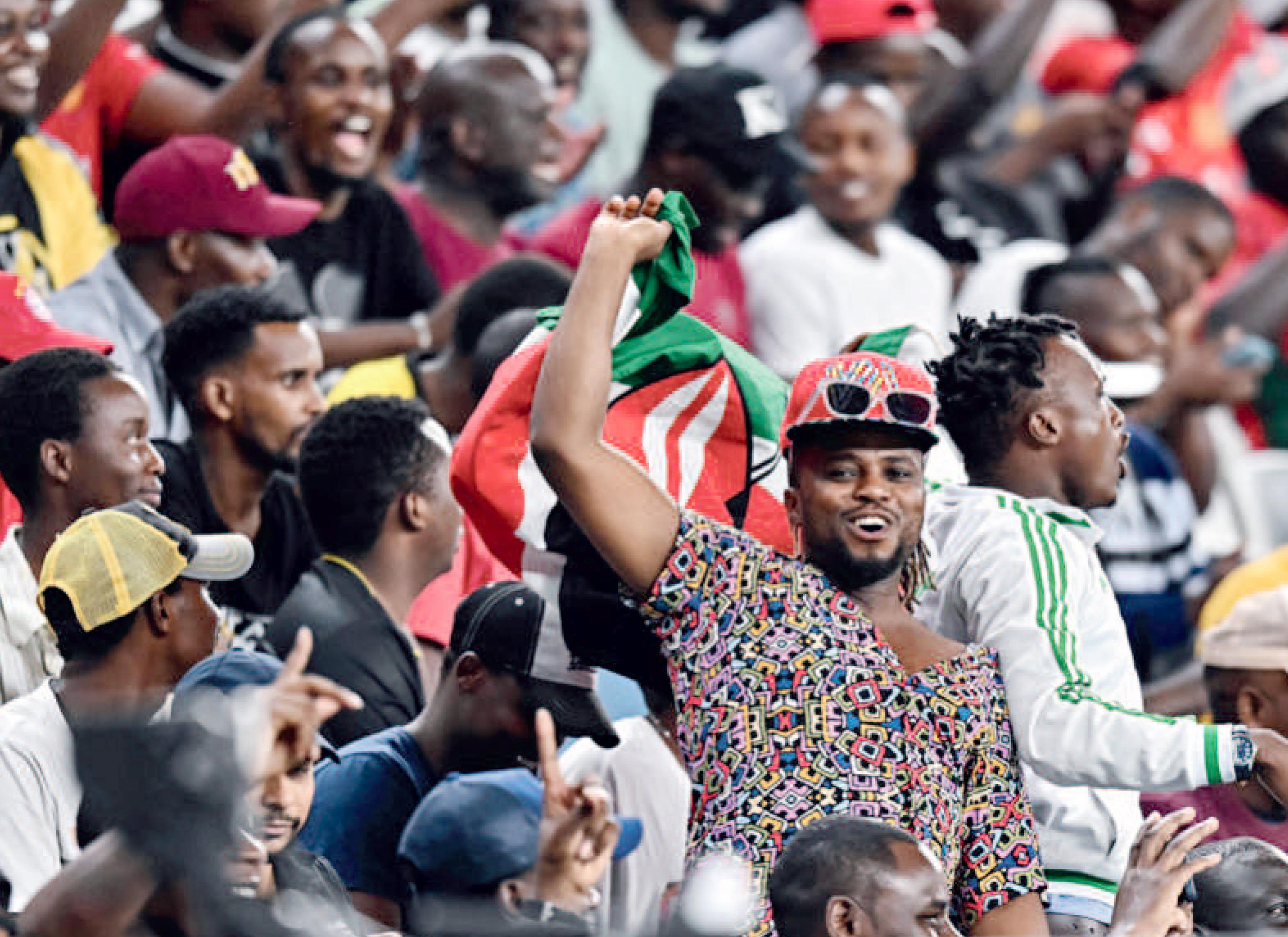 Fans celebrating with the Kenyan flag